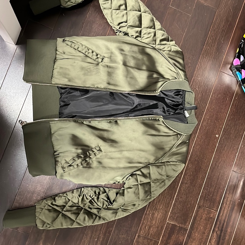 Bomber jacket, it’s olive green. Very nice to pair with ligh washed jeans.